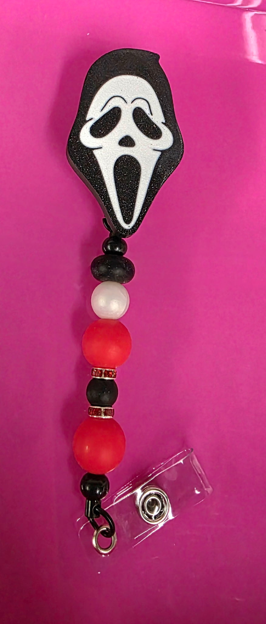 BEADED BADGE REEL GF