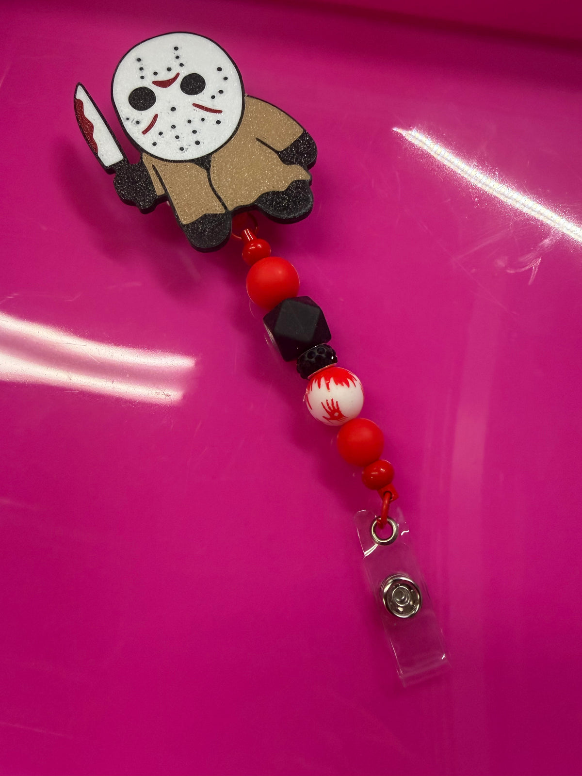 BEADED BADGE REEL JASON