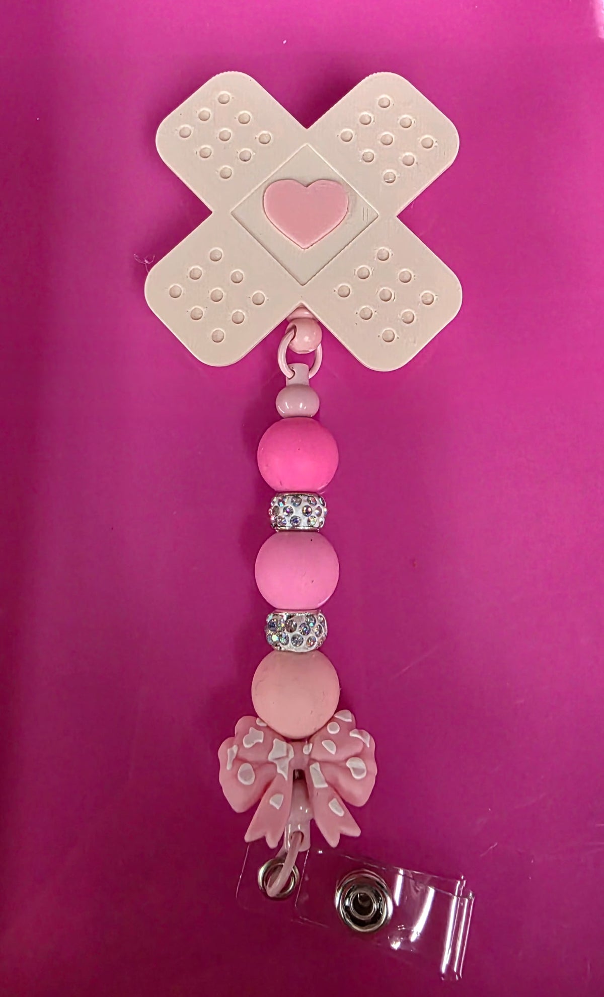 BEADED BADGE REEL BAND AID