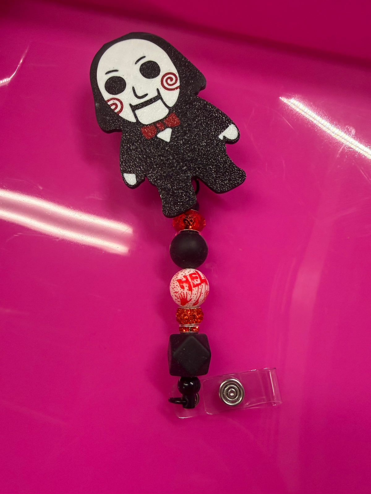 BEADED BADGE REEL jigsaw